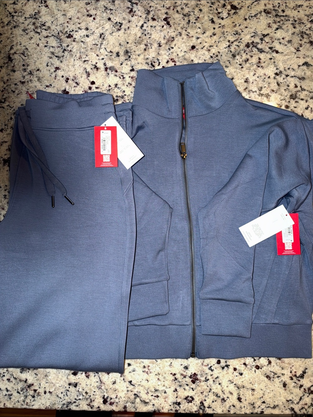 womens Full-Zip air essential jacket and matching pants.